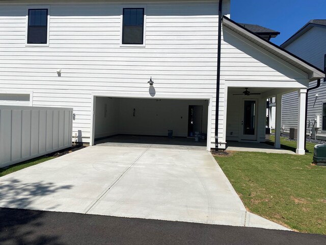 1200 N Pinot, Duncan, SC 29334 - view of home's exterior with driveway, a lawn, an attached garage, central air condition unit, and ceiling fan