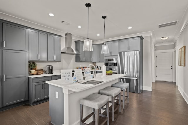 1200 N Pinot, Duncan, SC 29334 - kitchen with stainless steel appliances, wall chimney range hood, gray cabinets, ornamental molding, and dark wood finished floors