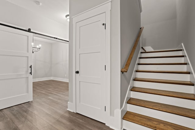 1208 N Pinot, Duncan, SC 20334 - stairs featuring a barn door and wood finished floors