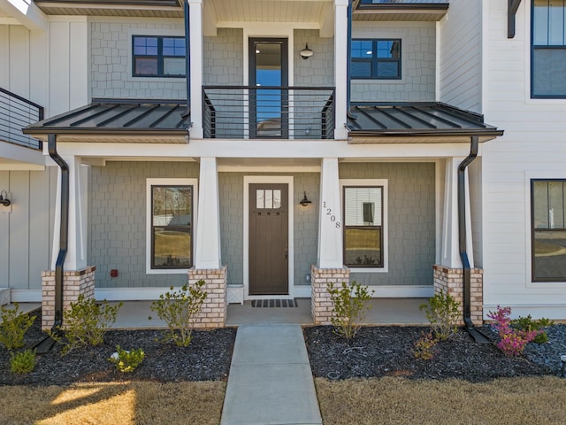 1208 N Pinot, Duncan, SC 20334 - doorway to property with a standing seam roof, a porch, a balcony, and metal roof