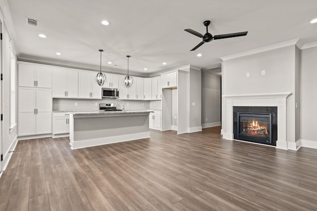 1208 N Pinot, Duncan, SC 20334 - unfurnished living room featuring ornamental molding, recessed lighting, a ceiling fan, baseboards, and wood finished floors