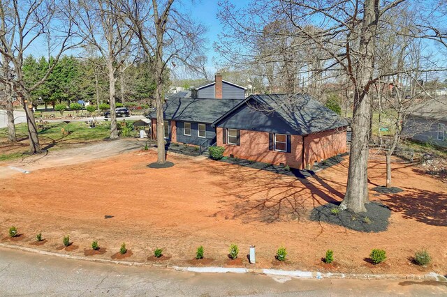 2 Willowood, Spartanburg, SC 29303 - view of front of home featuring driveway and a chimney