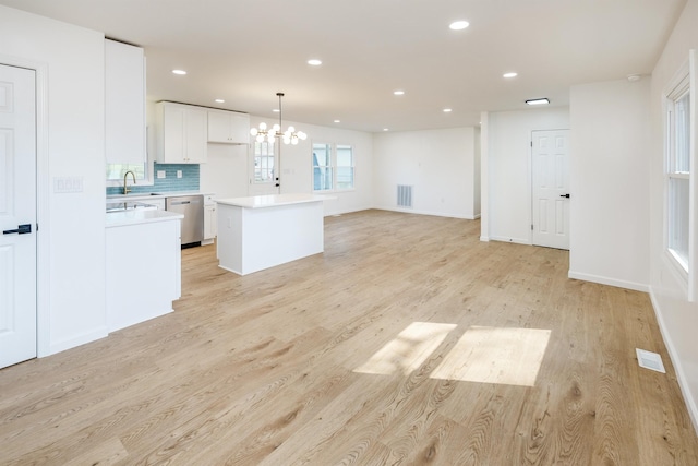 2 Willowood, Spartanburg, SC 29303 - unfurnished living room with a chandelier, light wood-type flooring, recessed lighting, a sink, and baseboards