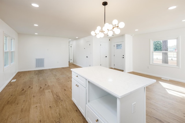 2 Willowood, Spartanburg, SC 29303 - kitchen featuring open floor plan, a center island, white cabinetry, decorative light fixtures, and recessed lighting
