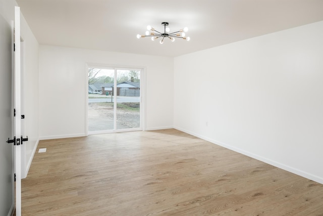2 Willowood, Spartanburg, SC 29303 - spare room with a chandelier, light wood finished floors, and baseboards