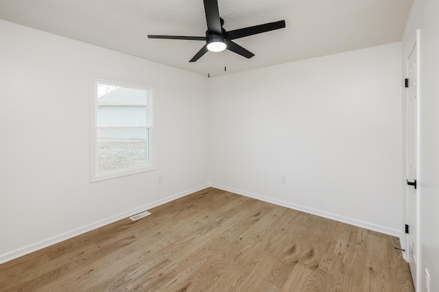 2 Willowood, Spartanburg, SC 29303 - spare room with light wood-style flooring, a ceiling fan, and baseboards