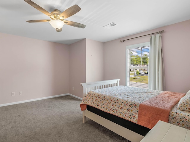bedroom featuring carpet floors, baseboards, and a ceiling fan