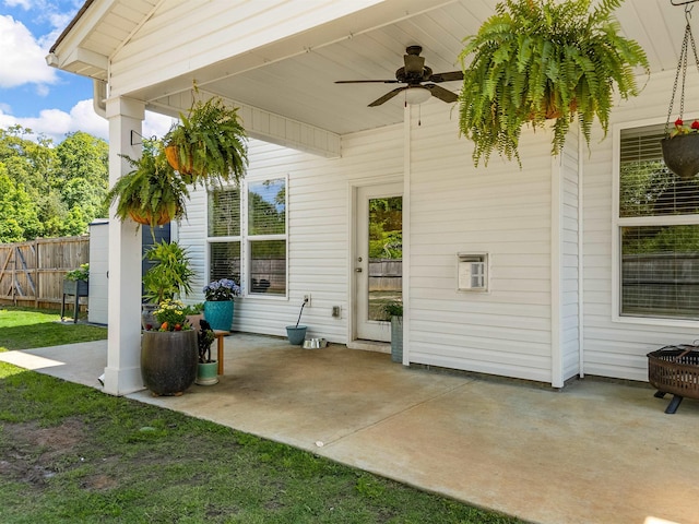 view of patio featuring ceiling fan and fence