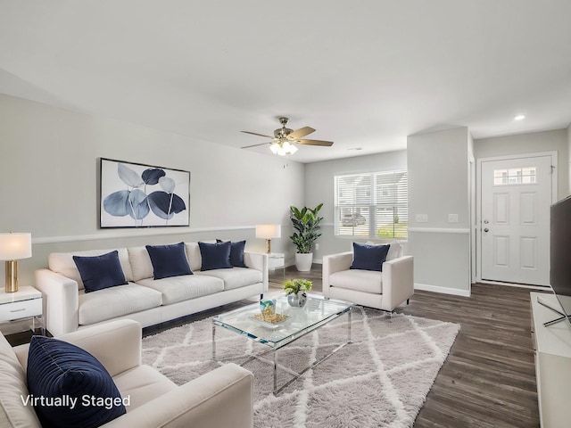 living room featuring ceiling fan, baseboards, dark wood-type flooring, and recessed lighting