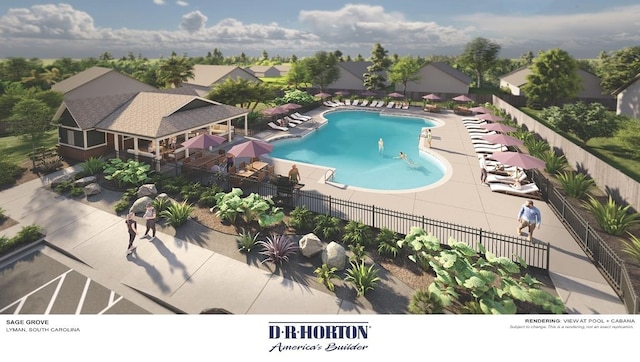 community pool with fence and a patio