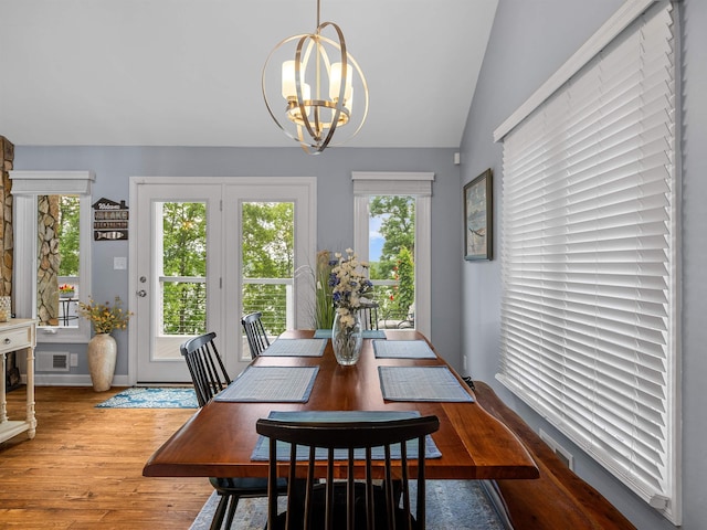 702 Lakewinds, Inman, SC 29349 - dining area with a chandelier, healthy amount of natural light, wood finished floors, and lofted ceiling