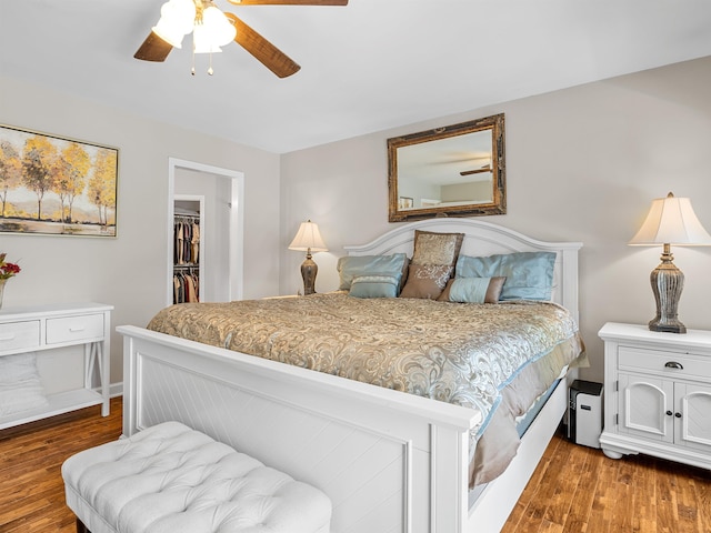 702 Lakewinds, Inman, SC 29349 - bedroom with wood finished floors, a walk in closet, a closet, and ceiling fan