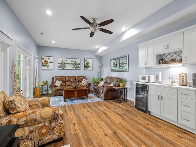 702 Lakewinds, Inman, SC 29349 - living area featuring wine cooler, wet bar, ceiling fan, light wood-type flooring, and recessed lighting