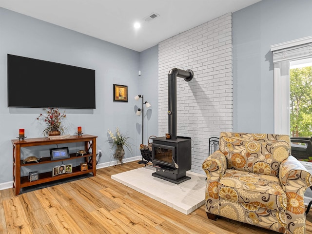 702 Lakewinds, Inman, SC 29349 - living room with light wood-type flooring, a wood stove, baseboards, and recessed lighting