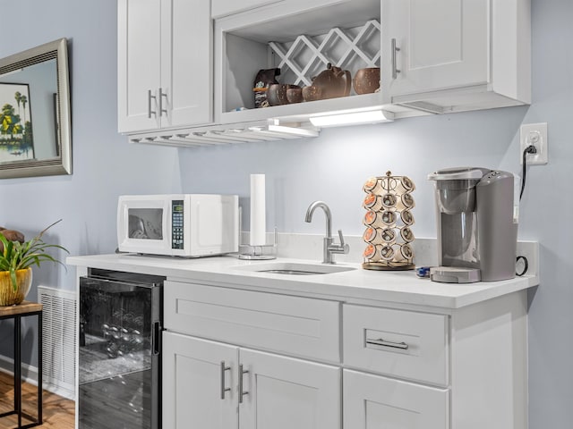 702 Lakewinds, Inman, SC 29349 - bar with wine cooler, a sink, and white microwave