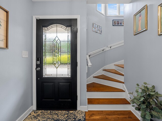 702 Lakewinds, Inman, SC 29349 - entrance foyer with stairs, wood finished floors, and baseboards