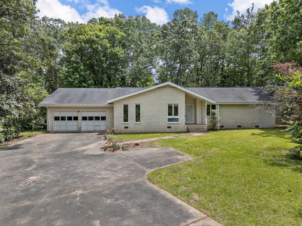 1158 Gaffney, Jonesville, SC 29353 - view of front of property with crawl space, driveway, a garage, and brick siding