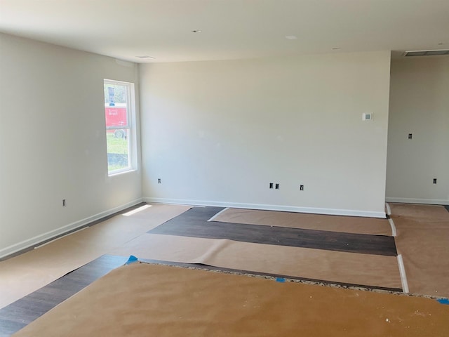 empty room with baseboards