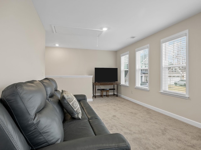 living area with attic access, carpet flooring, baseboards, and recessed lighting