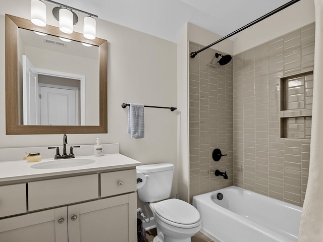 bathroom with toilet, vanity, and shower / bath combination