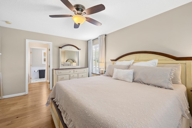 bedroom featuring light wood-type flooring, baseboards, and a ceiling fan