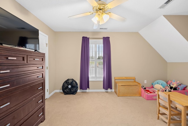 playroom with light carpet, baseboards, ceiling fan, and vaulted ceiling