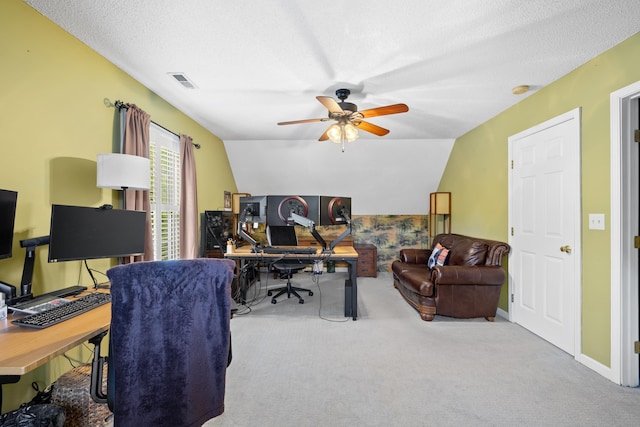 office with carpet flooring, a ceiling fan, lofted ceiling, and a textured ceiling