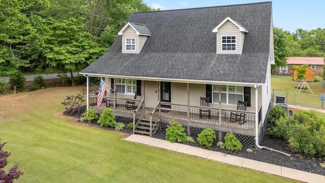 view of front of property featuring a shingled roof and covered porch