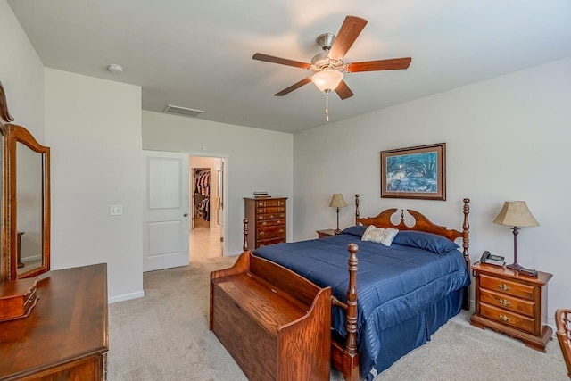 bedroom featuring light carpet, ceiling fan, and baseboards