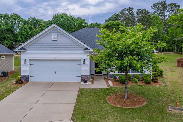 view of front of house featuring concrete driveway, a front yard, a garage, and stone siding