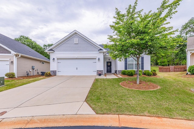 view of front of property featuring driveway, a garage, stone siding, and central AC