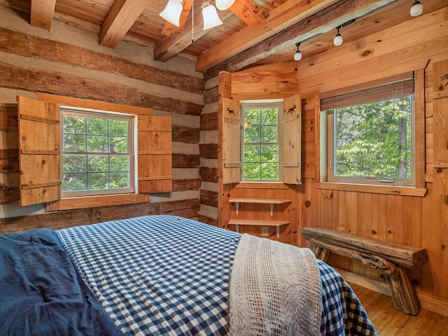 18 Lennox, Landrum, SC 29356 - bedroom featuring wood ceiling, beam ceiling, multiple windows, wood walls, and wood finished floors
