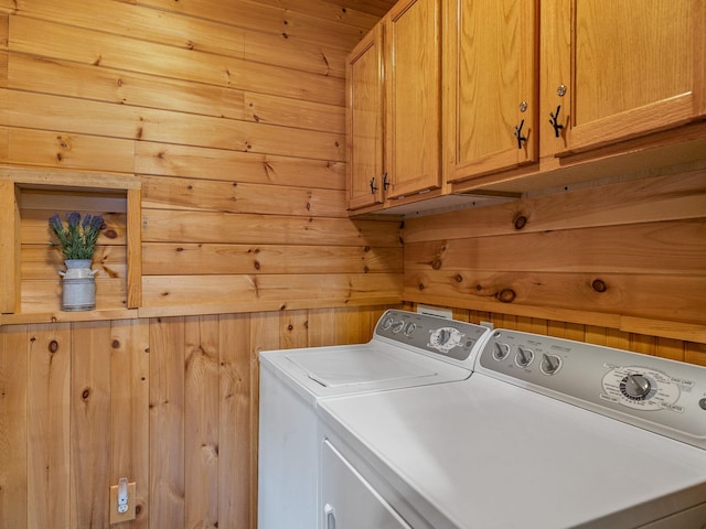 18 Lennox, Landrum, SC 29356 - clothes washing area featuring washer and dryer, cabinet space, and wooden walls