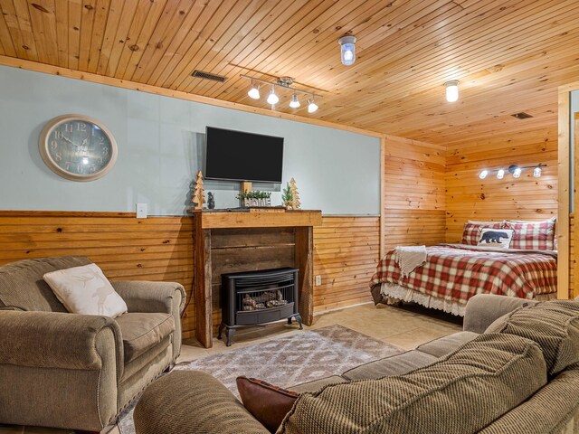 18 Lennox, Landrum, SC 29356 - tiled bedroom featuring wooden walls, wood ceiling, rail lighting, and a wainscoted wall