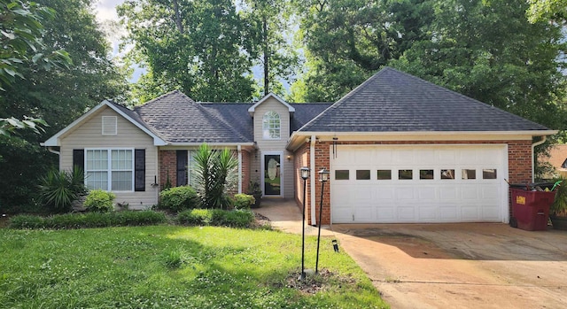 traditional-style house featuring brick siding, concrete driveway, an attached garage, and a front yard