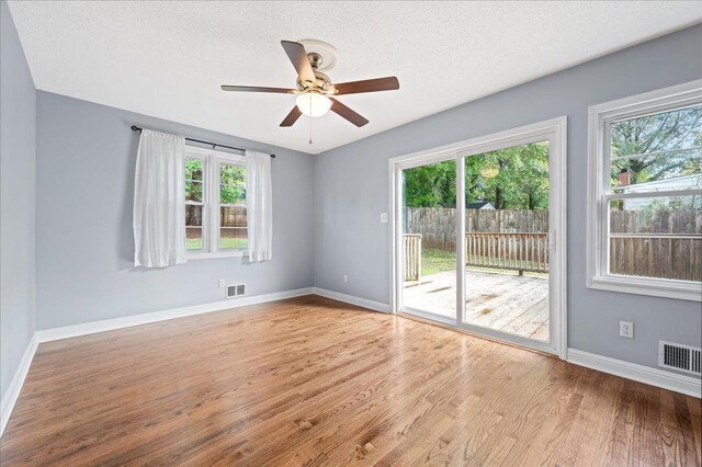 222 Woodview, Spartanburg, SC 29306 - empty room featuring healthy amount of natural light, a ceiling fan, wood finished floors, and baseboards