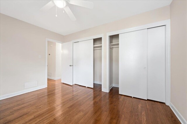 222 Woodview, Spartanburg, SC 29306 - unfurnished bedroom with two closets, wood finished floors, baseboards, and ceiling fan