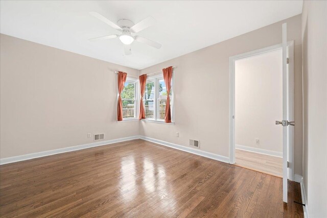 222 Woodview, Spartanburg, SC 29306 - empty room with wood finished floors, a ceiling fan, and baseboards