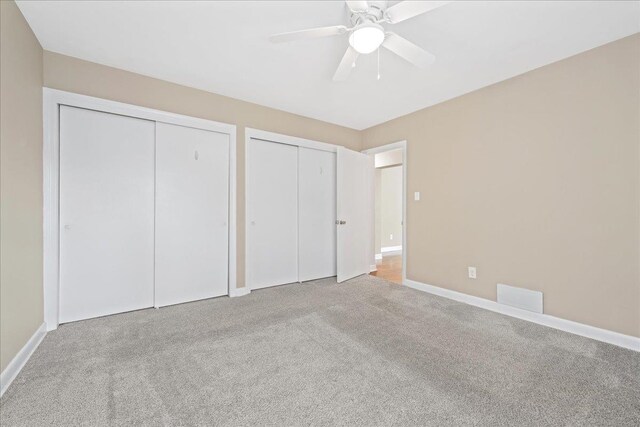 222 Woodview, Spartanburg, SC 29306 - unfurnished bedroom featuring multiple closets, carpet flooring, and baseboards