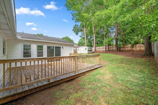 222 Woodview, Spartanburg, SC 29306 - view of yard featuring an outbuilding, a deck, and a storage shed
