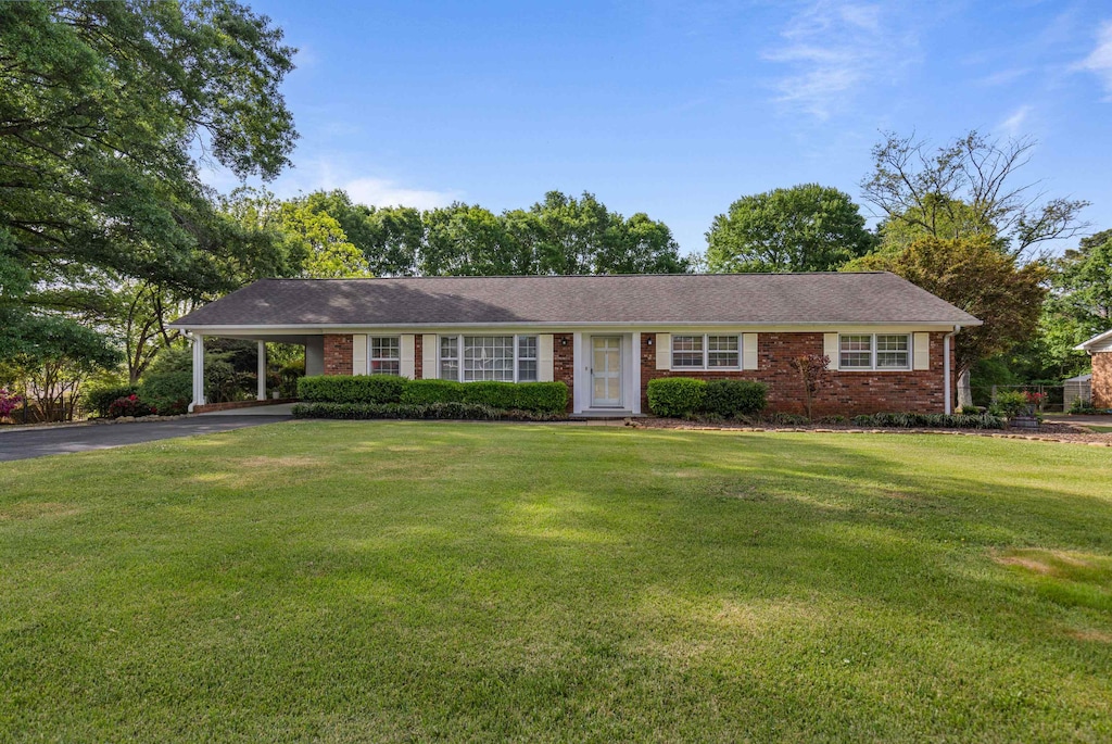 8 Montford, Boiling Springs, SC 29316 - single story home with driveway, a front yard, brick siding, and a carport