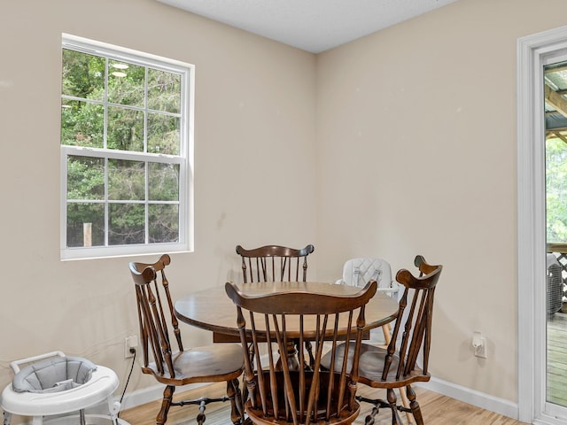 250 E Blackstock, Enoree, SC 29335 - dining space featuring baseboards, light wood finished floors, and plenty of natural light
