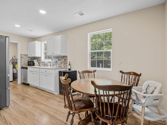 250 E Blackstock, Enoree, SC 29335 - dining room with light wood finished floors, recessed lighting, healthy amount of natural light, and a textured ceiling