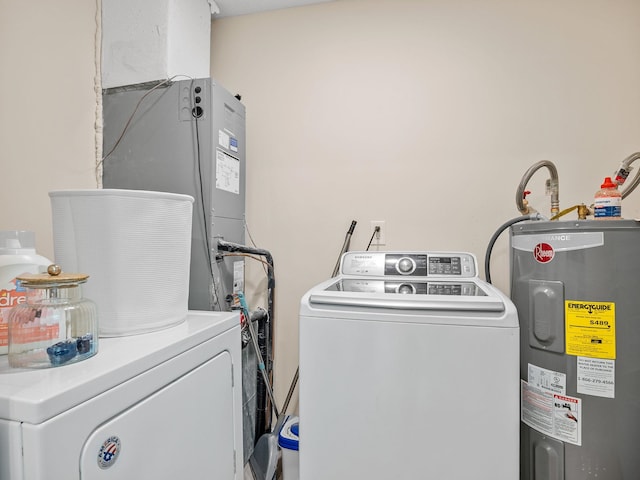250 E Blackstock, Enoree, SC 29335 - clothes washing area with electric water heater and washer and clothes dryer