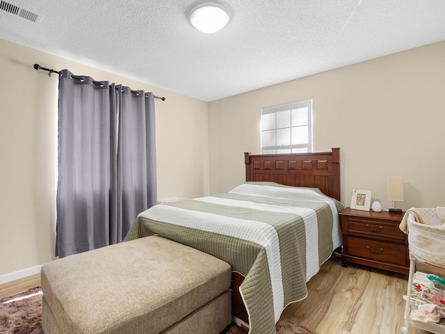 250 E Blackstock, Enoree, SC 29335 - bedroom featuring light wood finished floors and a textured ceiling