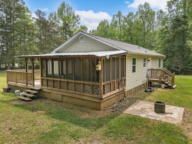 250 E Blackstock, Enoree, SC 29335 - rear view of property with a sunroom, a yard, a patio, and a fire pit