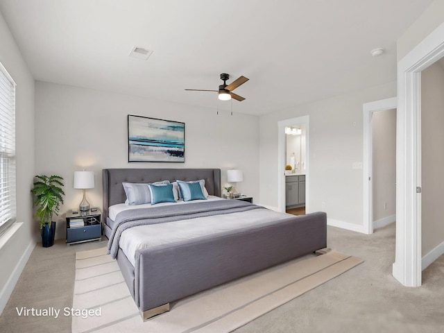 421 Hazelcote, Greenville, SC 29617 - bedroom with light carpet, baseboards, a ceiling fan, and connected bathroom
