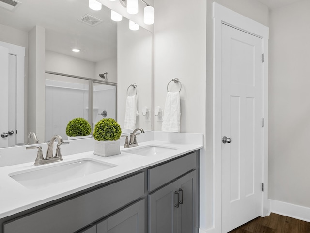 421 Hazelcote, Greenville, SC 29617 - full bathroom with a stall shower, wood finished floors, double vanity, baseboards, and recessed lighting