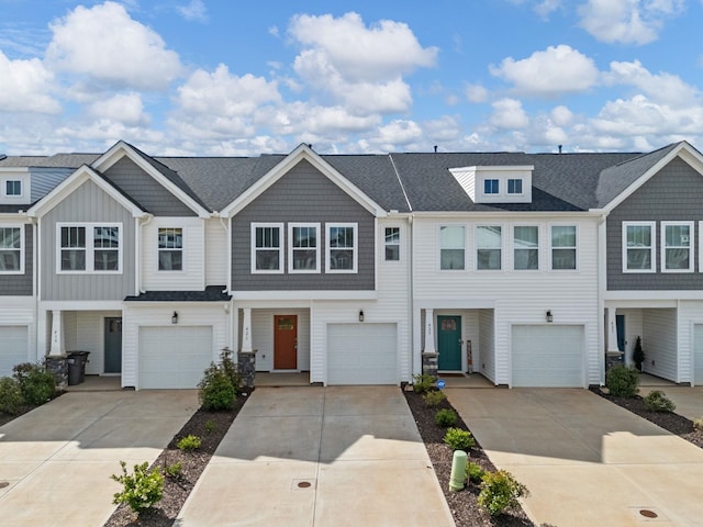 421 Hazelcote, Greenville, SC 29617 - view of property featuring driveway, a garage, and roof with shingles