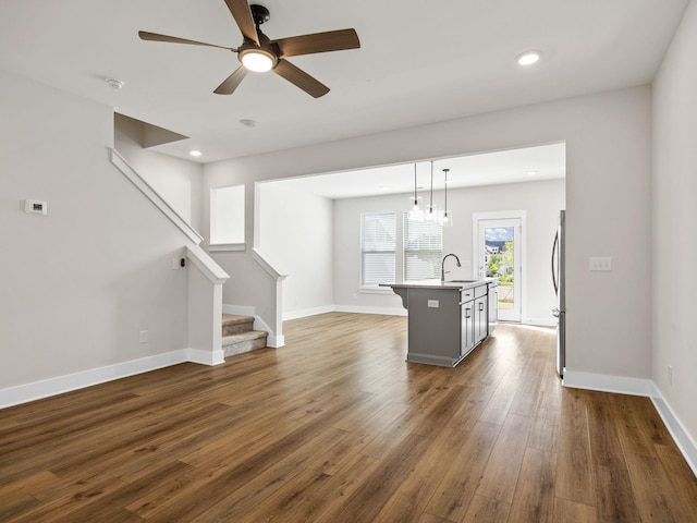 421 Hazelcote, Greenville, SC 29617 - kitchen featuring open floor plan, dark wood finished floors, an island with sink, a ceiling fan, and freestanding refrigerator